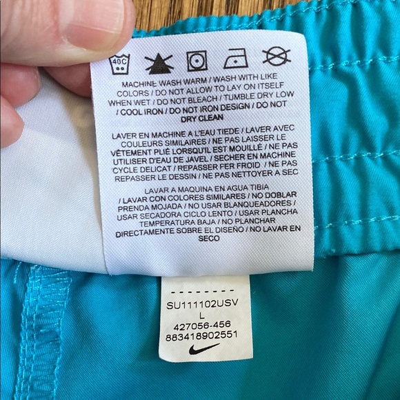 Bright turquoise with white side stripe Nike shorts with pockets, size women’s L - Picture 4 of 16